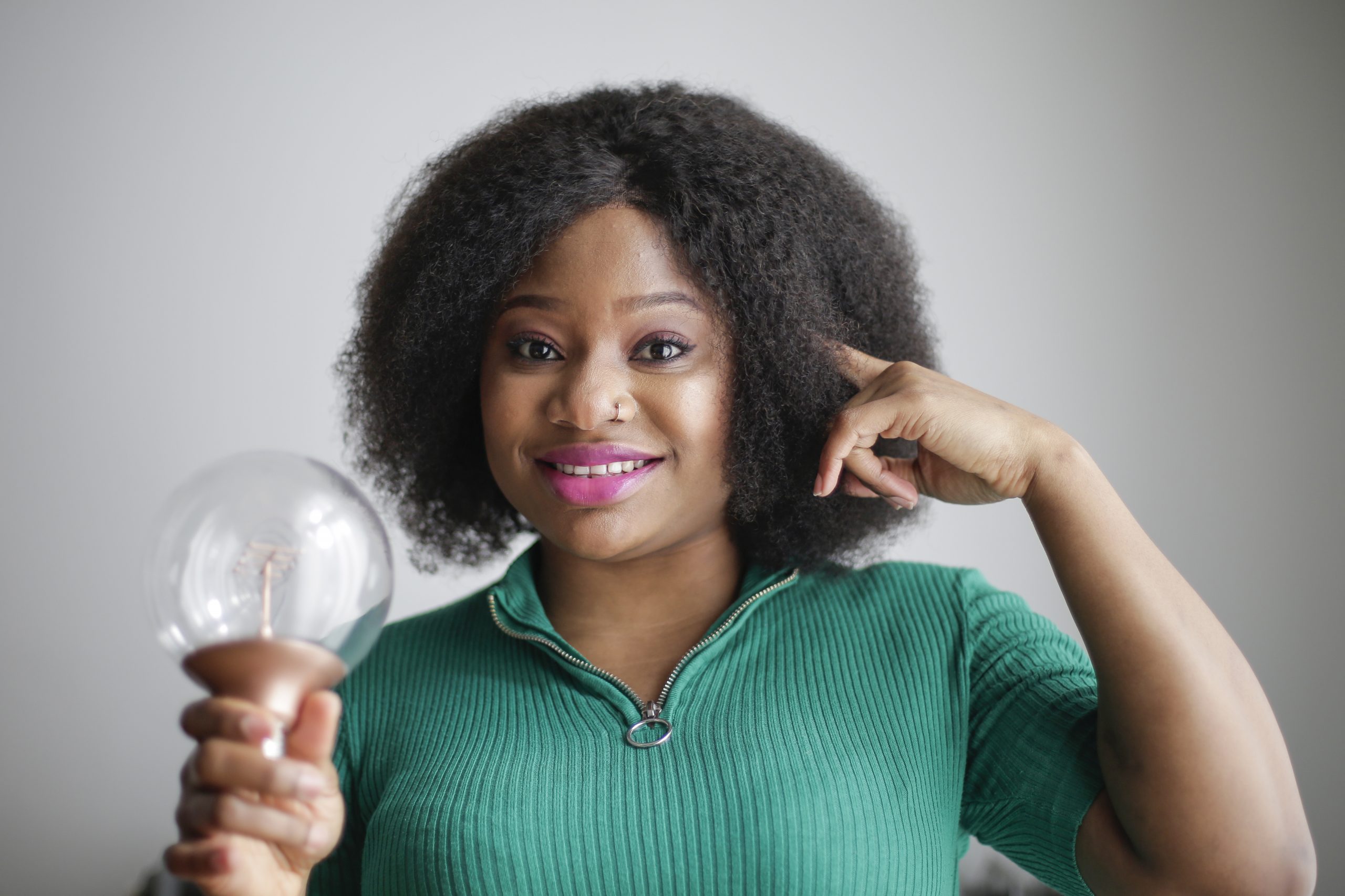What Are Your Options for Brain Enhancement? positive-young-african-american-lady-holding-light-bulb-in-3973059