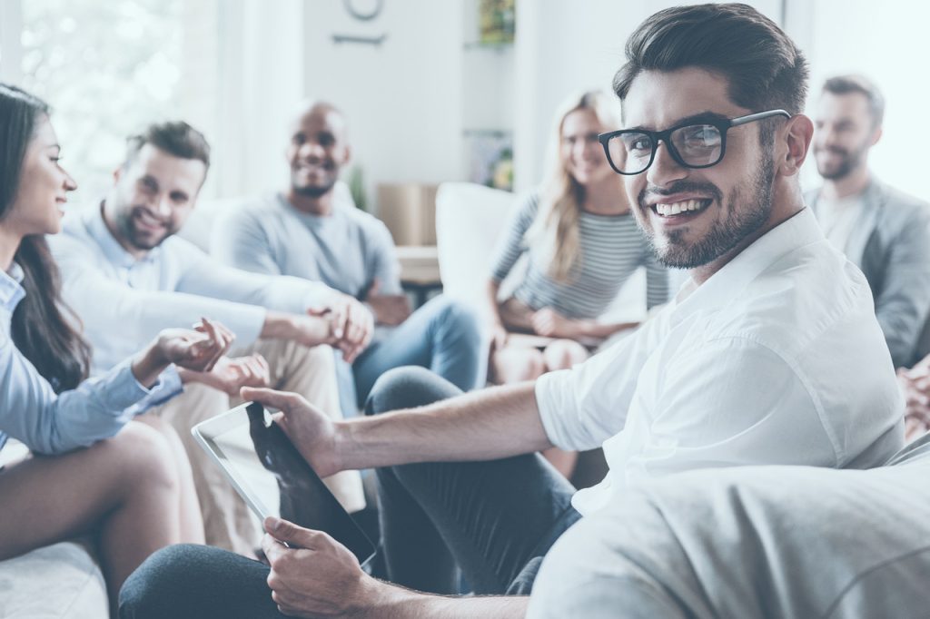 A group of professionals working in an office setting.